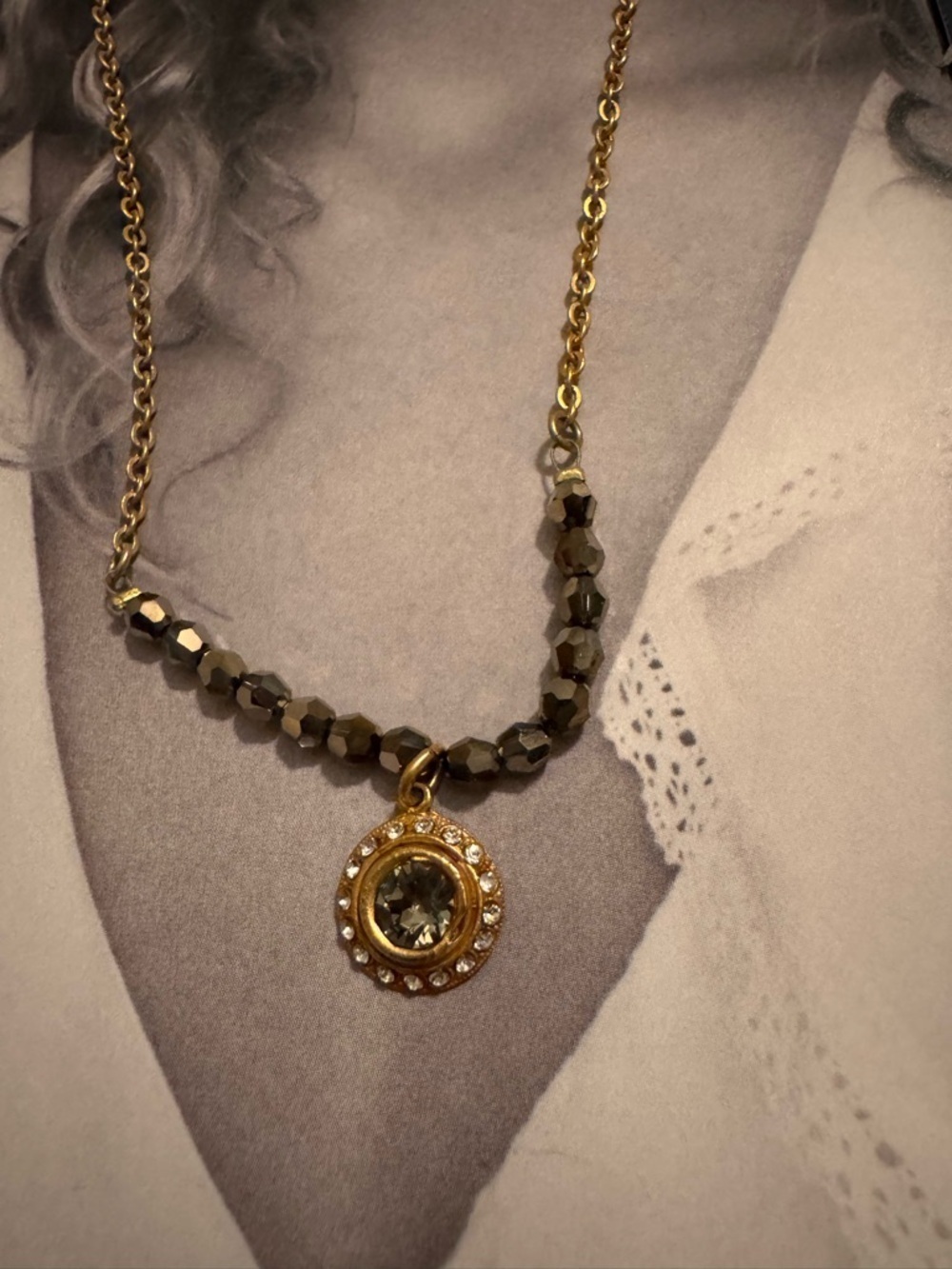 Unique Gold-Tone Necklace with Hematite Beads and Round Pendant